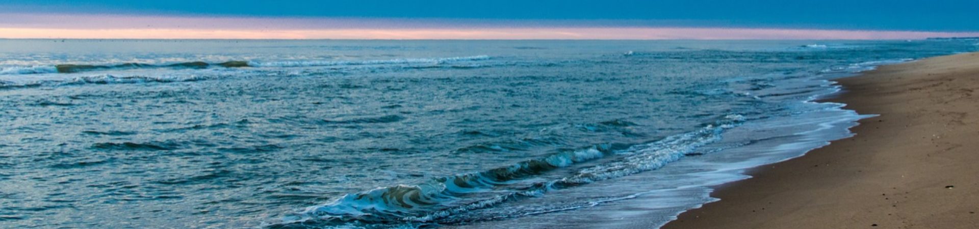 Sandy beach with waves